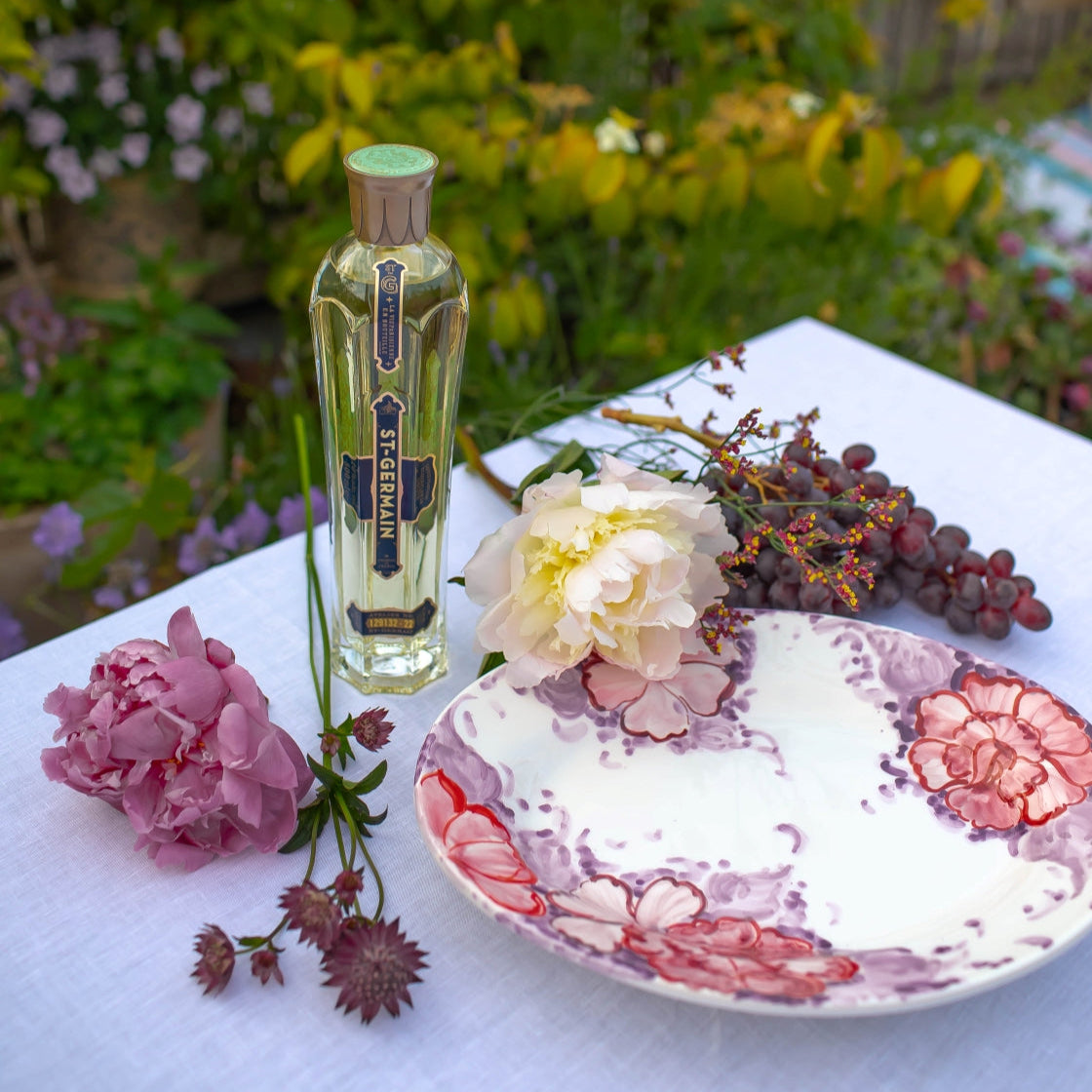 Elevate hosting at home with the Dinner Date large sharing plate from the Summer Aperitif Edit and a bottle of St-Germain Elderflower Liqueur 70cl to add unexpected flavour to your favourite cocktail.